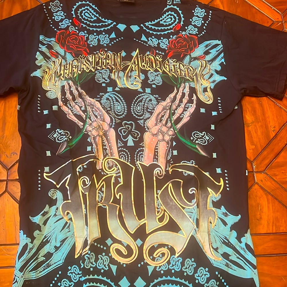 New with tags Christian Audigier t shirt XXL fits like a Large.